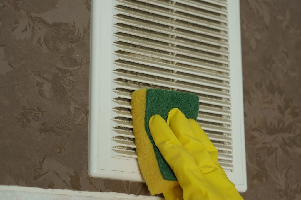 A layer of dust on the ventilation grate.Dust is wiped with a sponge