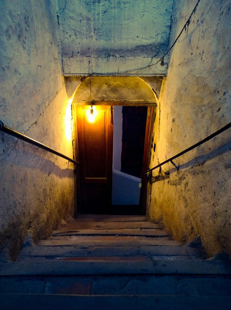 Dark stairs going down to a basement